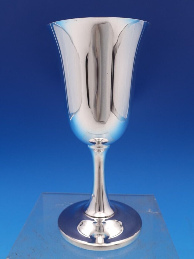 Wallace Sterling Silver Water Goblet #14 6.75" Tall Antique: Wallace Sterling Silver Water Goblet #14 6.75" Tall Antique This exquisite Wallace Sterling Silver Water Goblet is a true testament to fine craftsmanship. Standing at 6 3/4" tall with a base diameter 