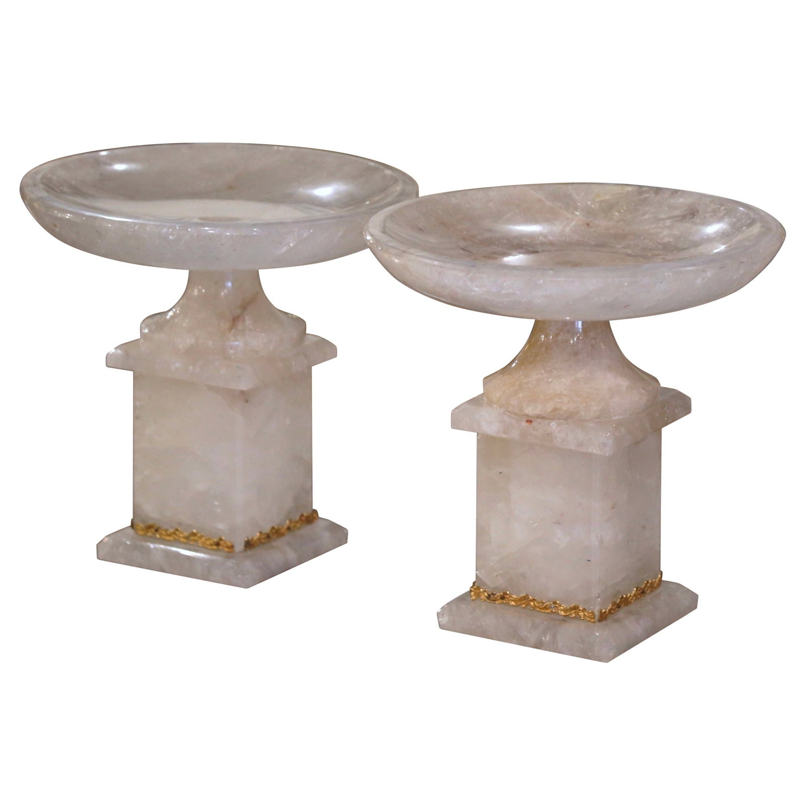 Hand-Carved Rock Crystal Compotes with Swivel Bowls Pair from Brazil: Hand-Carved Rock Crystal Compotes with Swivel Bowls Pair from Brazil This elegant pair of Brazilian compotes features hand-carved rock crystal bowls with natural inclusions, creating a luminous and re