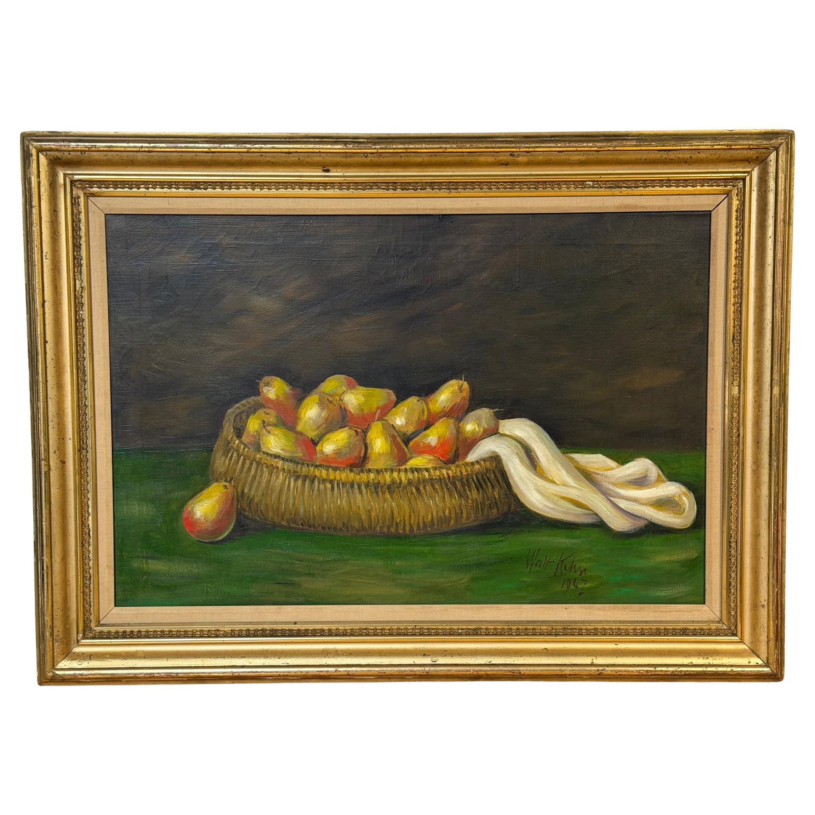 Still Life Oil Painting by Walt Kuhn Featuring Pears in Basket 1947: Still Life Oil Painting by Walt Kuhn Featuring Pears in Basket 1947 This oil on canvas still life, painted by Walt Kuhn in 1947, depicts a woven wicker basket filled with yellow and red pears on a gre