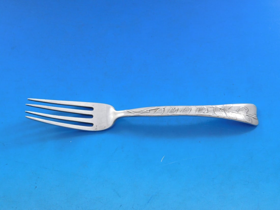 Tiffany Sterling Silver Lap Over Edge Dessert Fork 6.25": Tiffany Sterling Silver Lap Over Edge Dessert Fork 6.25" This exquisite dessert junior fork from Tiffany & Co. features the elegant Lap Over Edge pattern, distinguished by delicate acid-etched leaves.