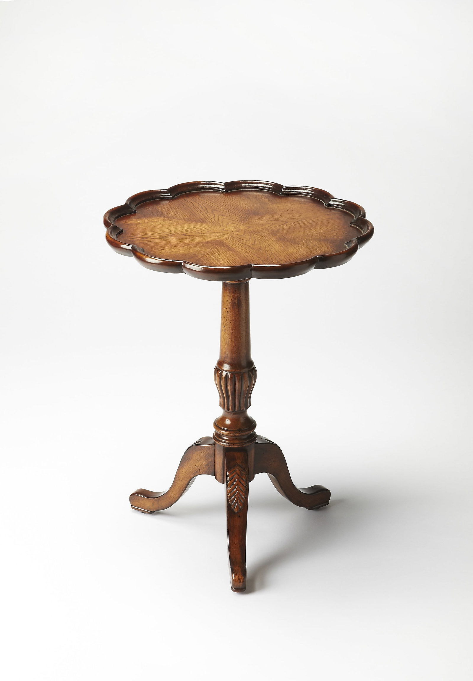 Butler Dansby Oak Round Accent Table: Butler Dansby Oak Round Accent Table Enhance your living space with this Elegant Oak Veneer Accent Table, designed in a vintage style. This new side table features a hand-carved scalloped edge and a p