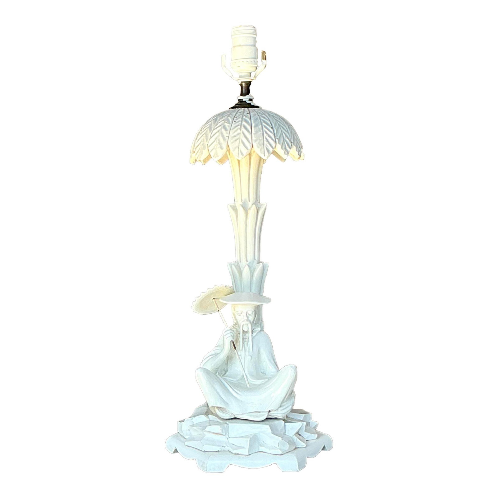 Vintage Coastal Character Lamp with Intricate Leaf Shade: Vintage Coastal Character Lamp with Intricate Leaf Shade Discover this unique vintage coastal lamp, a captivating work of art that features a meticulously carved figure seated beneath a delicately sha