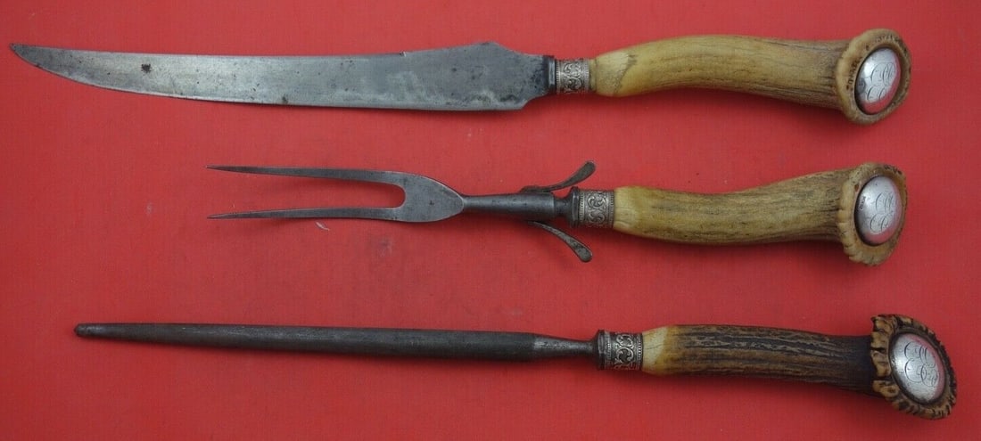 Vintage Antler Handle Carving Set 3-Pc with Silver Ferrule: Vintage Antler Handle Carving Set 3-Pc with Silver Ferrule This exquisite 3-piece roast carving set features an elegant antler handle crafted by various makers, showcasing a classic design that dates 
