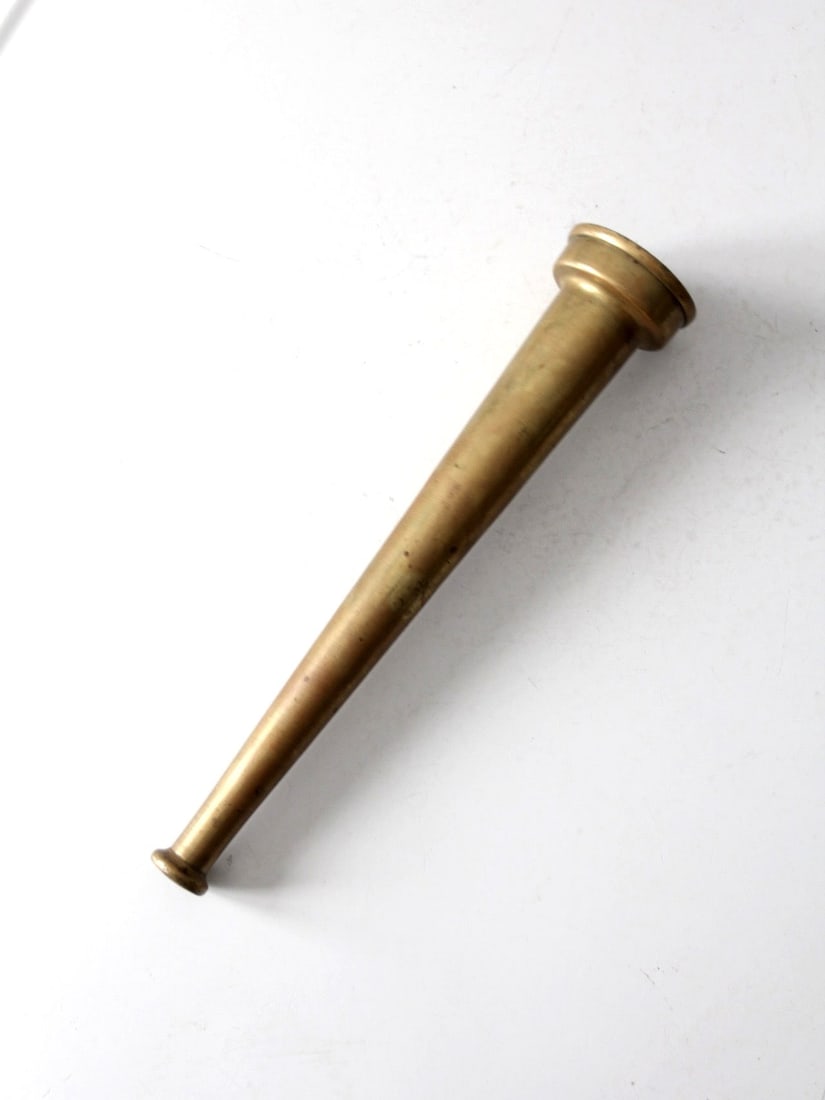 1930s Vintage Brass Firehose Nozzle Decorative Accent: 1930s Vintage Brass Firehose Nozzle Decorative Accent This vintage brass firehose nozzle, dating back to the 1930s-1940s, features a tapered form and threaded base that highlight its utilitarian origi