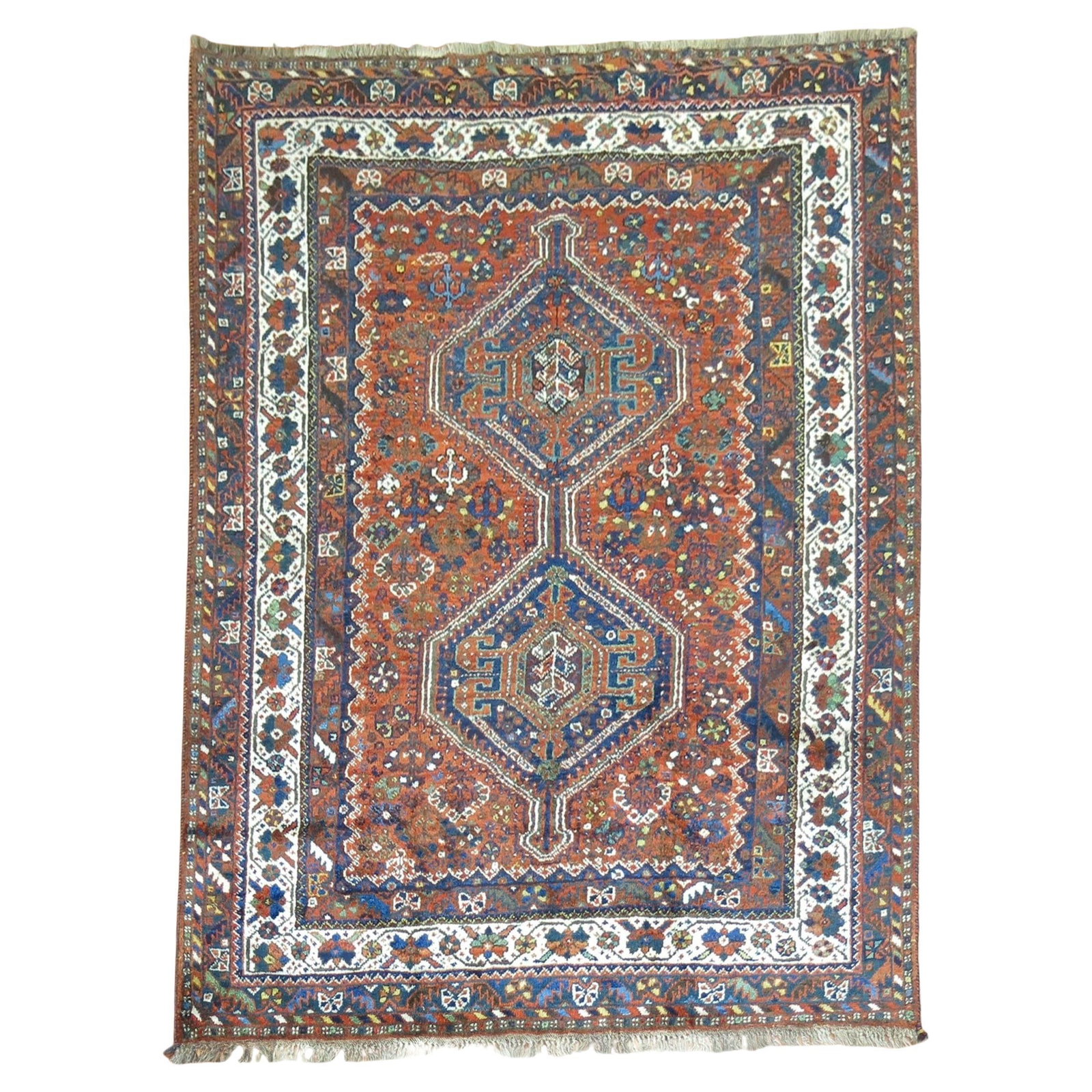 Vintage Hand-Woven Tribal Shiraz Rug from Early 20th Century Persia: Vintage Hand-Woven Tribal Shiraz Rug from Early 20th Century Persia Discover the charm of this Tribal Antique Shiraz Rug, a stunning piece that showcases the artistry of early 20th-century Persian cra