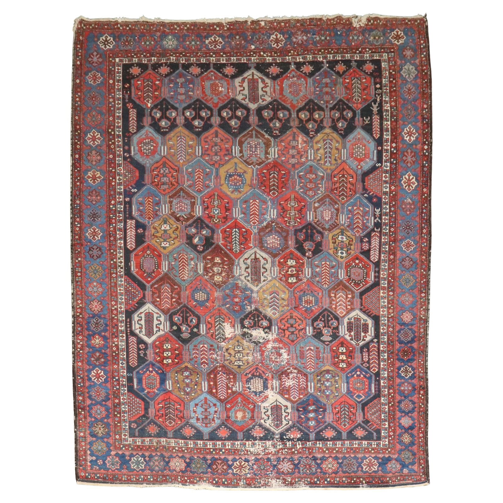 Antique Persian Bakhtiari Hand-Knotted Wool Rug 7'3" x 9'5": Antique Persian Bakhtiari Hand-Knotted Wool Rug 7'3" x 9'5" This stunning Antique Geometric Persian Bakhtiari rug showcases a rich heritage with its vibrant patterns and intricate designs. Hand-knotte
