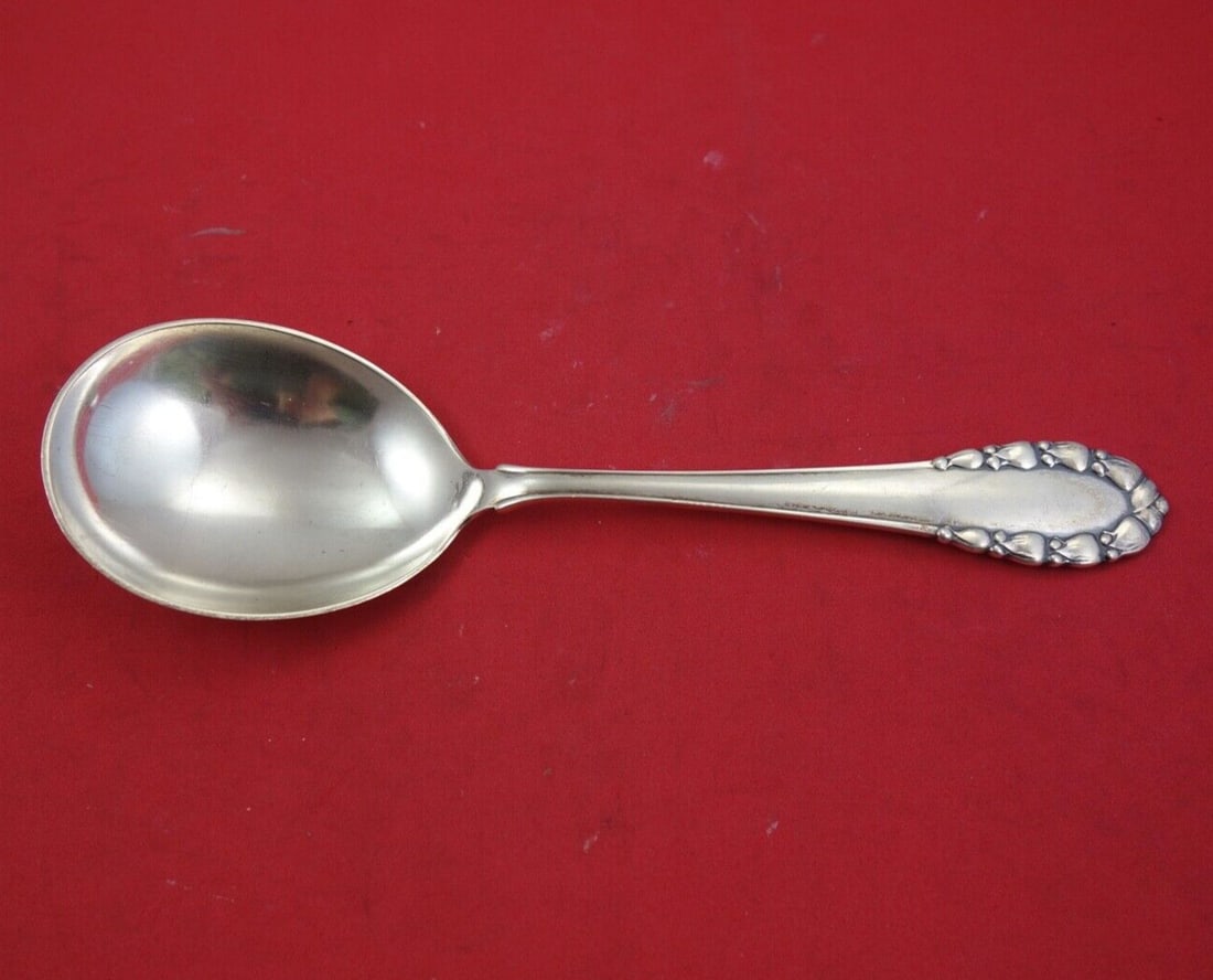 Georg Jensen Lily of the Valley Sterling Silver Berry Spoon 8 3/8": Georg Jensen Lily of the Valley Sterling Silver Berry Spoon 8 3/8" This exquisite serving spoon features the iconic Lily of the Valley pattern by Georg Jensen, crafted from high-quality sterling silve