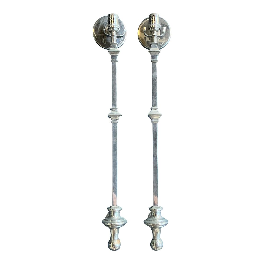 Pair of Tall Polished Chrome Regency Style Wall Sconces: Pair of Tall Polished Chrome Regency Style Wall Sconces This pair of vintage Regency wall sconces features a tall, slender silhouette with sleek vertical stems, accented by architectural knops and geo