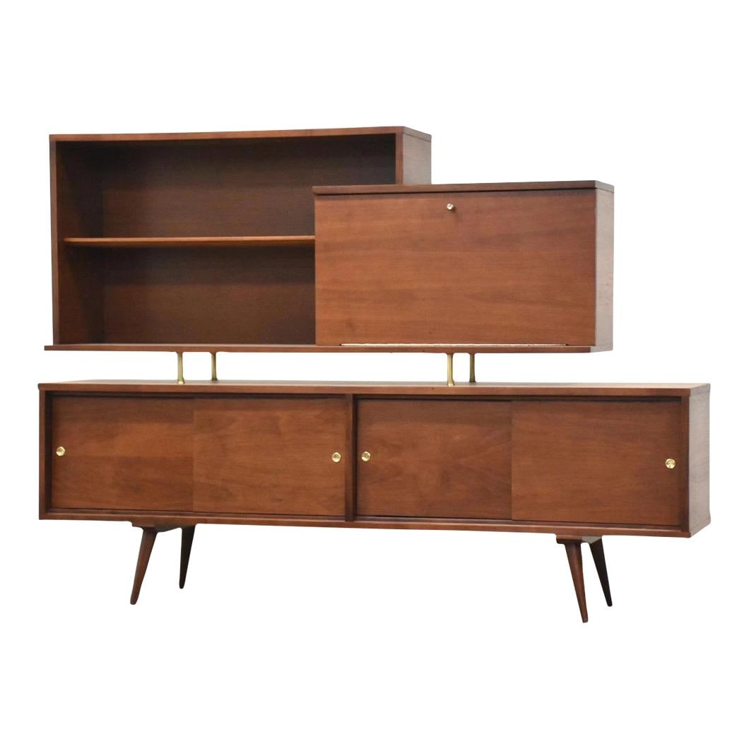 1960s Mid-Century Walnut Sideboard Credenza with Brass Details: 1960s Mid-Century Walnut Sideboard Credenza with Brass Details This stunning mid-century modern walnut sideboard credenza features a beautifully refinished surface and a convenient drop-down serving a