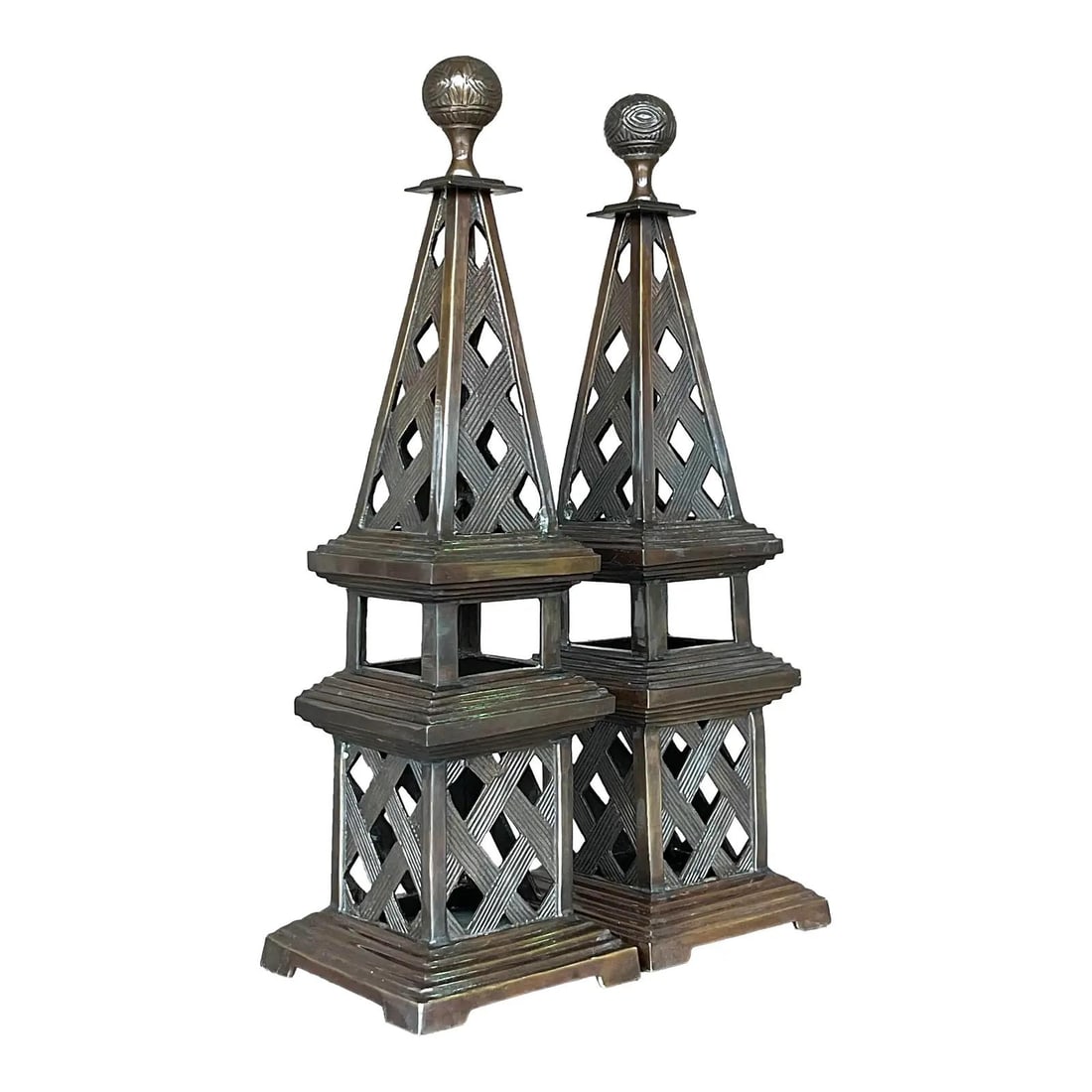 Chic Vintage Regency Pair of Patinated Metal Obelisks: Chic Vintage Regency Pair of Patinated Metal Obelisks Enhance your decor with this stunning pair of vintage Regency obelisks. Crafted from chic patinated metal, these obelisks feature an elegant open 