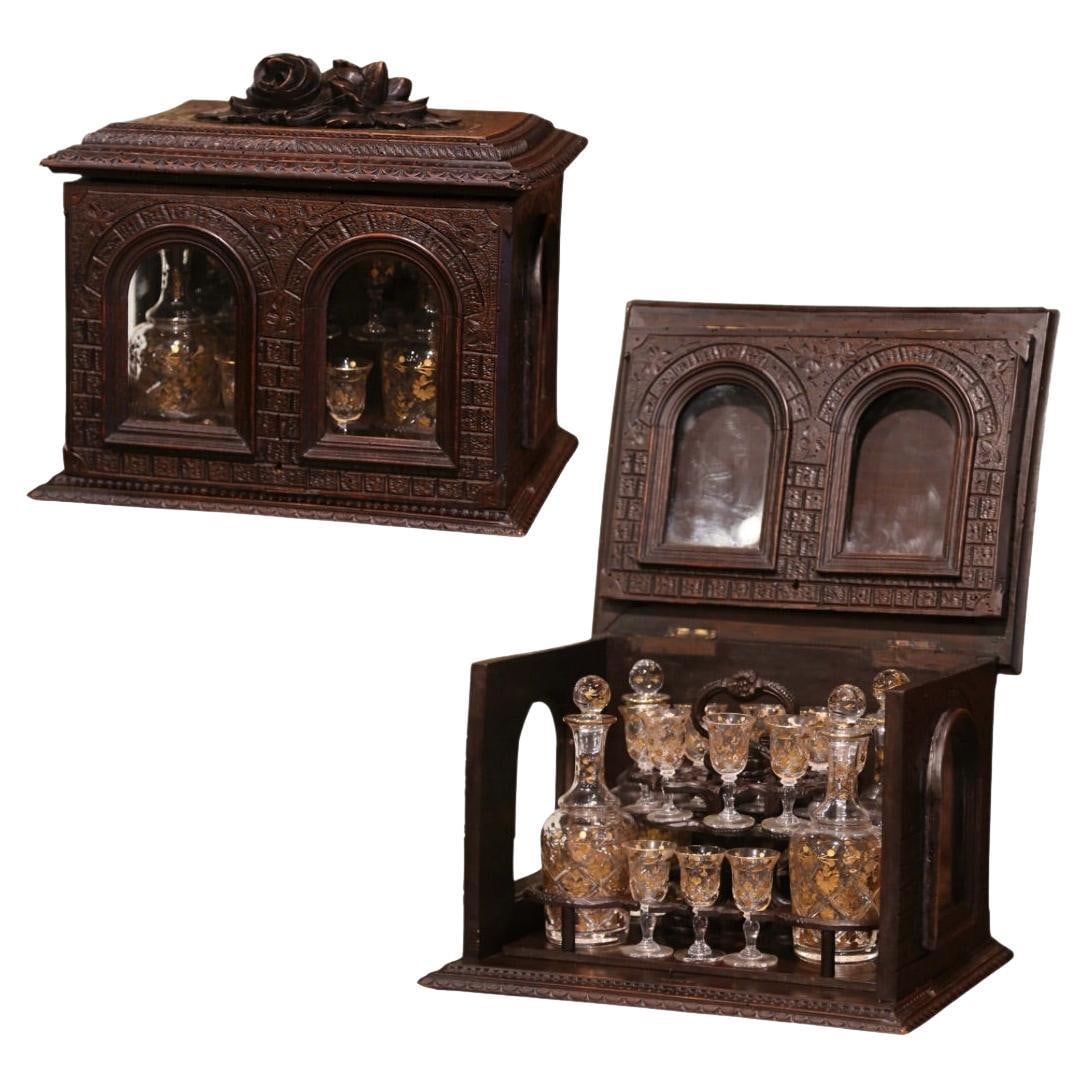 19th Century French Black Forest Liquor Box with Cut Glass Cordials: 19th Century French Black Forest Liquor Box with Cut Glass Cordials Enhance your entertaining space with this exquisite 19th Century French Black Forest Carved Walnut and Glass Liquor Box, also known 