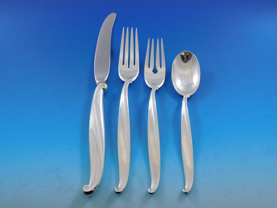 International Sterling Silver Swan Lake 4-Piece Place Setting: International Sterling Silver Swan Lake 4-Piece Place Setting Enhance your dining experience with this elegant 4-piece place setting in the exquisite Swan Lake pattern by International Sterling Silver