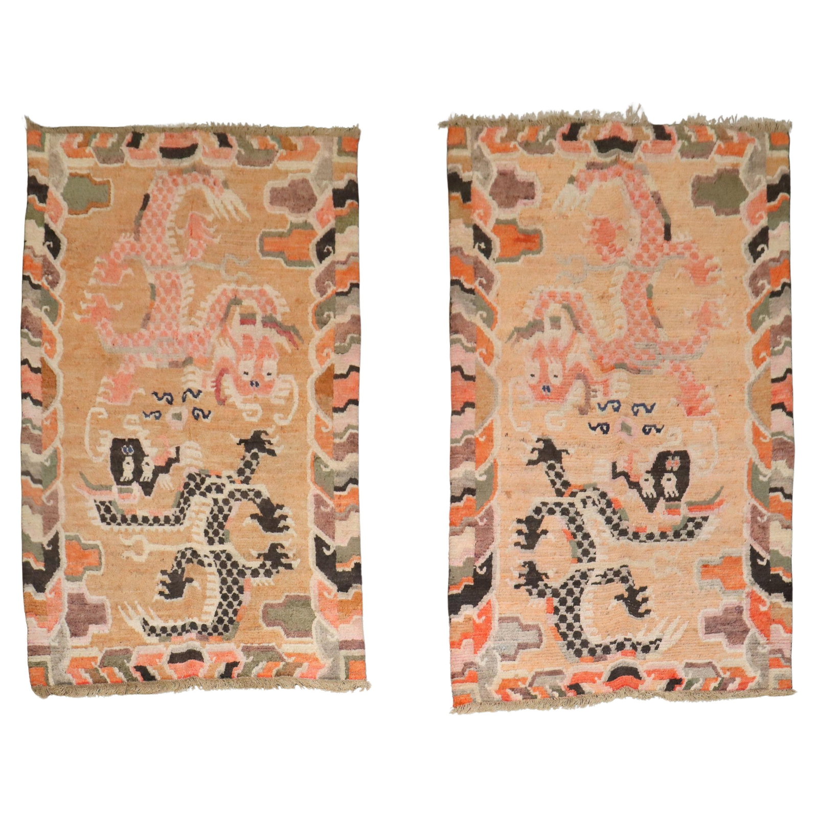 Set of Two Early 20th Century Tibetan Wool Dragon Bedside Rugs: Set of Two Early 20th Century Tibetan Wool Dragon Bedside Rugs This rare pair of antique Tibetan bedside rugs features intricate dragon motifs, showcasing the folk art style of early 20th-century Tibe