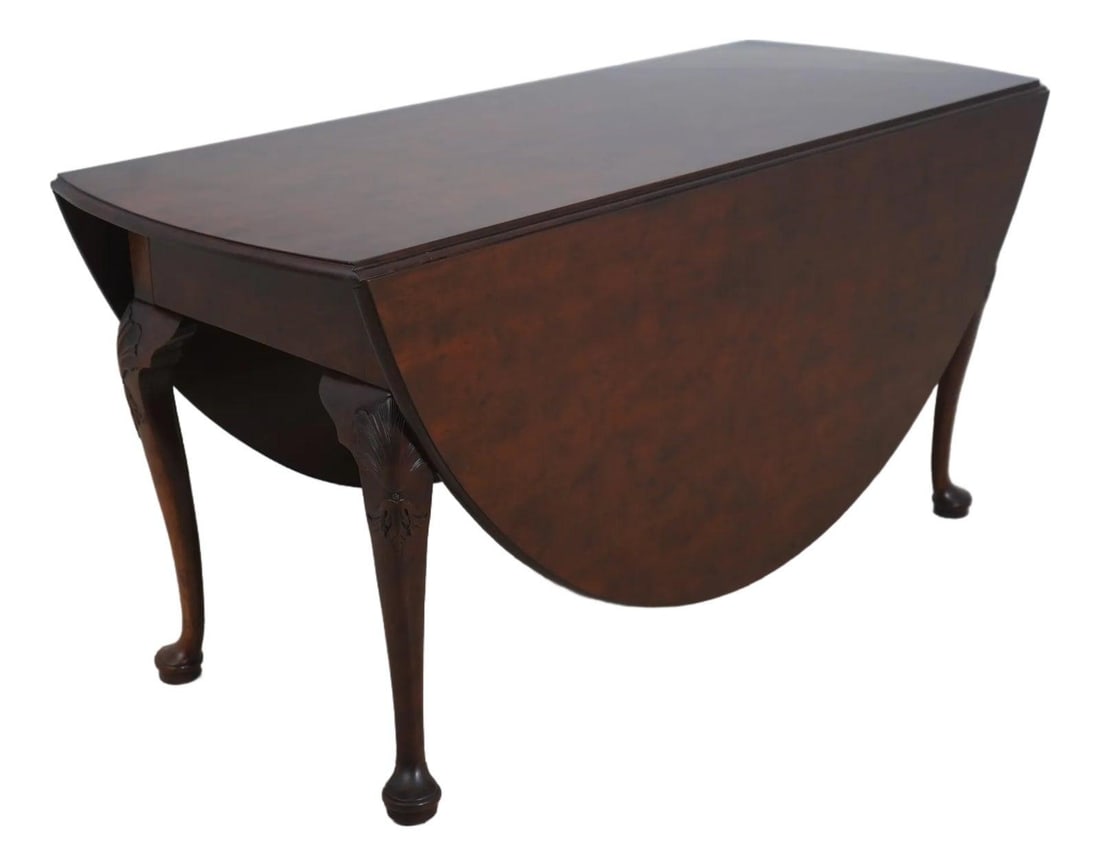 Mahogany Dropleaf Table with Queen Anne Legs from Williamsburg Collection: Mahogany Dropleaf Table with Queen Anne Legs from Williamsburg Collection This Baker Colonial Williamsburg Collection dropleaf table features fine carved details and high-quality construction in mahog