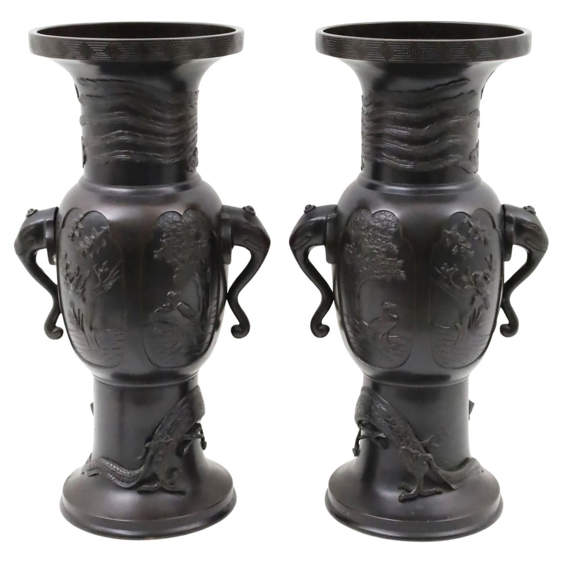 Set of 2 Meiji Era Japanese Bronze Vases with Elephant Handles: Set of 2 Meiji Era Japanese Bronze Vases with Elephant Handles This is a pair of large Japanese Meiji period patinated bronze vases from the late 19th century. Each vase features stylized elephant-for
