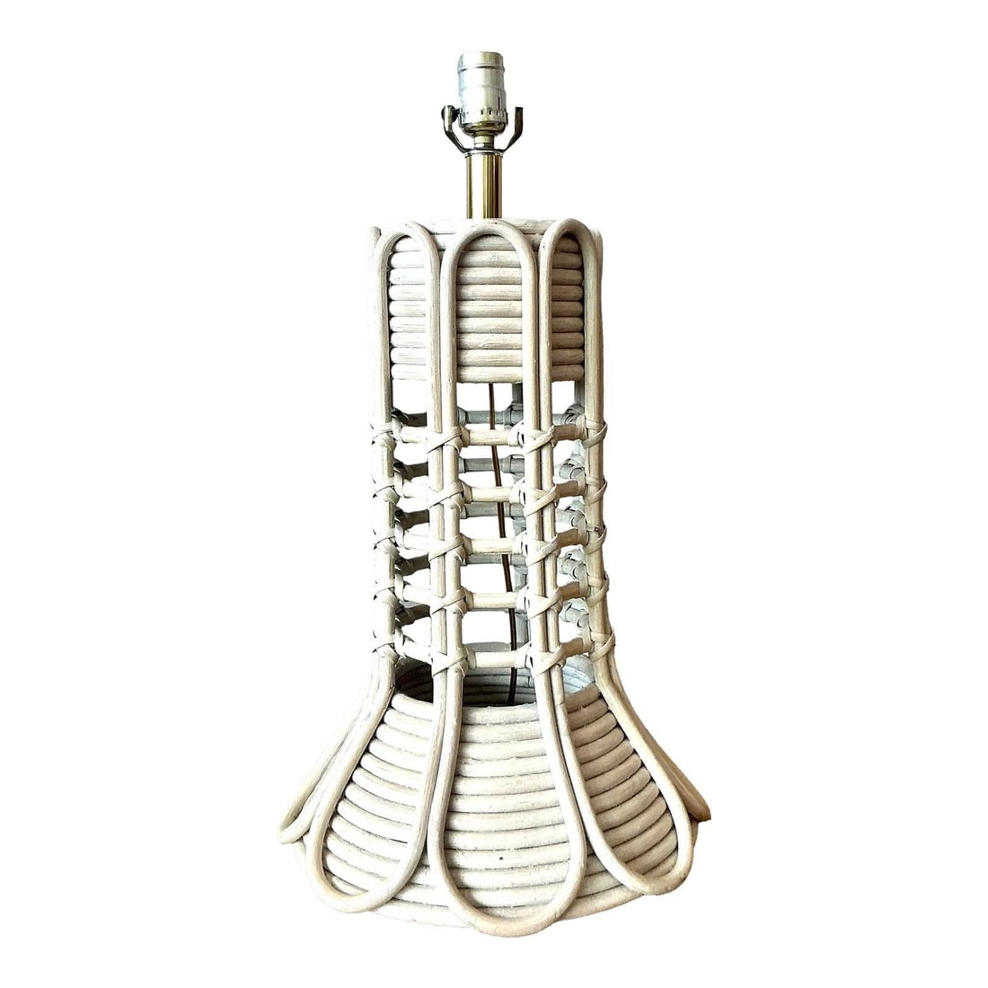 Whitewashed Rattan Pencil Reed Table Lamp With Sculptural Flared Design: Whitewashed Rattan Pencil Reed Table Lamp With Sculptural Flared Design This vintage table lamp features a sculptural design crafted from pencil reed and rattan, highlighted by a soft whitewashed fini
