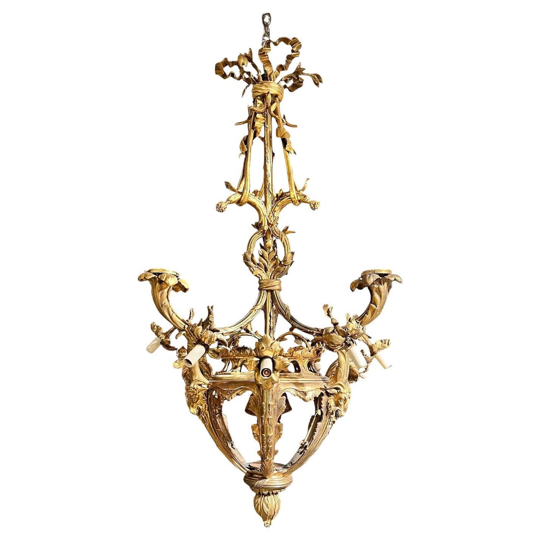 Early 20th Century French Gilt Bronze Louis XVI Style Chandelier with 15 Lights: Early 20th Century French Gilt Bronze Louis XVI Style Chandelier with 15 Lights This antique gilt bronze chandelier, crafted in the French Louis XV / XVI style, dates to the early 20th century. It fea