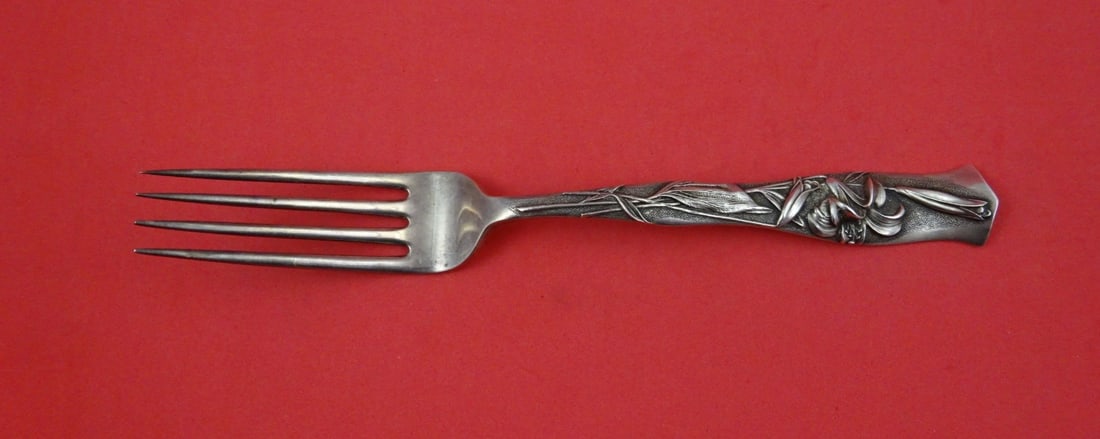 Sterling Silver Dinner Fork Flora Pattern by Shiebler with Garden Lily 8 3/8": Sterling Silver Dinner Fork Flora Pattern by Shiebler with Garden Lily 8 3/8" This is a Shiebler sterling silver dinner fork featuring the Flora pattern with a garden lily motif. The fork measures 8 3