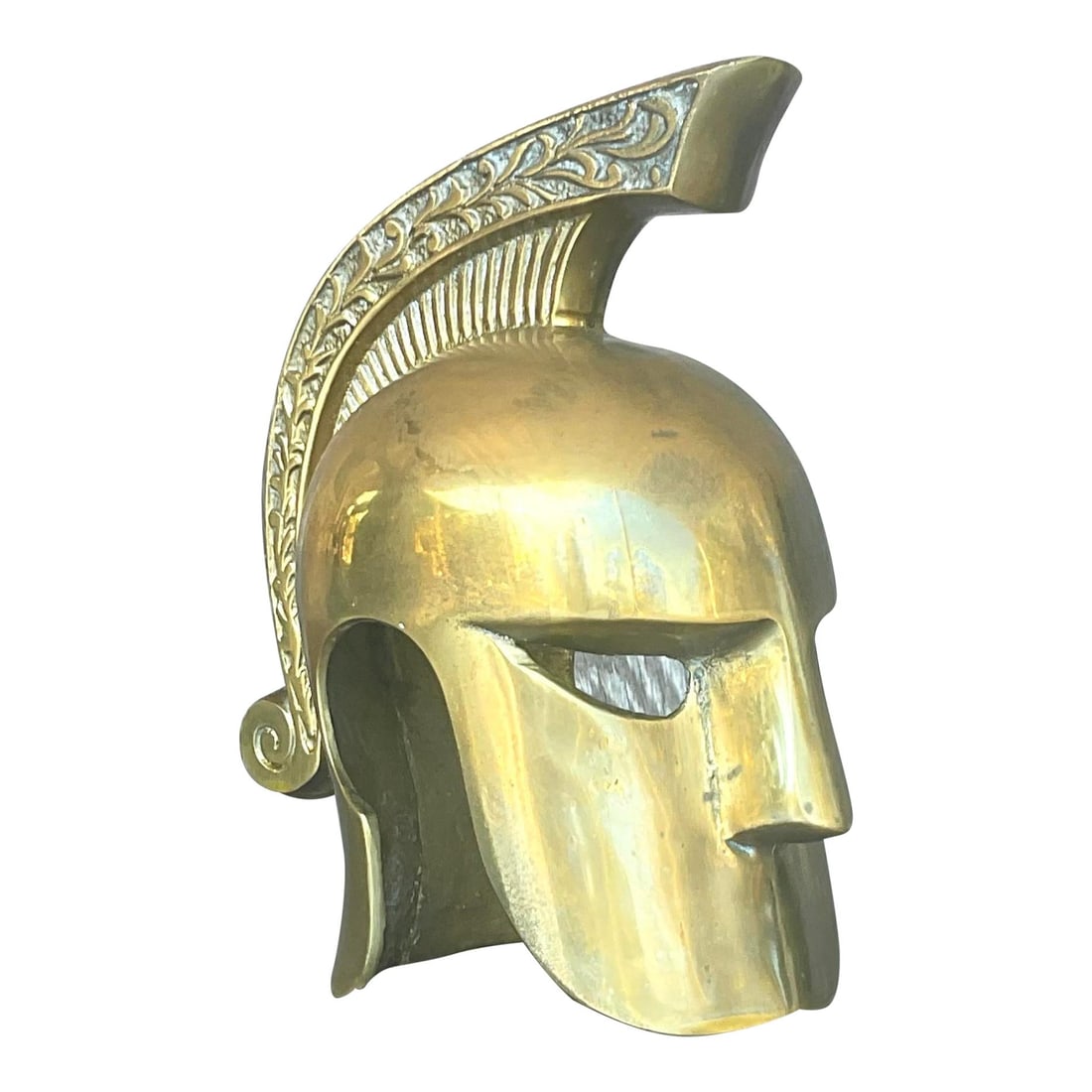 Polished Brass Decorative Gladiator Helmet Vintage Coastal Accent: Polished Brass Decorative Gladiator Helmet Vintage Coastal Accent This vintage Regency gladiator helmet is crafted from polished brass, offering a decorative accent perfect for display on a coffee tab
