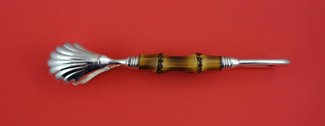Buccellati Tahiti Sterling Silver Ice Tong Bamboo Handle 8 3/8": Buccellati Tahiti Sterling Silver Ice Tong Bamboo Handle 8 3/8" Elevate your dining experience with the exquisite Tahiti Ice Tong by Buccellati, crafted from high-quality sterling silver. This vintage