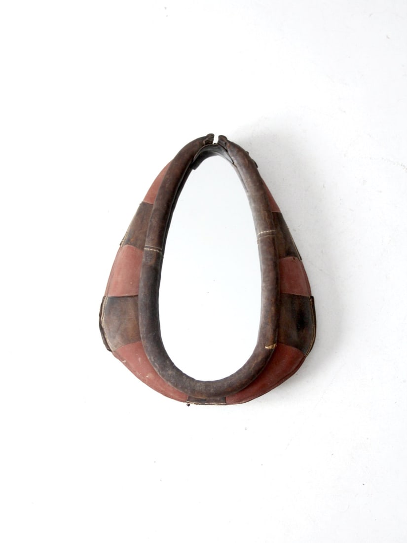 Antique Leather Horse Collar Mirror Vintage Equestrian Decor: Antique Leather Horse Collar Mirror Vintage Equestrian Decor This vintage equestrian mirror is a stunning accent piece, skillfully crafted from an antique red and black leather horse collar. It beauti