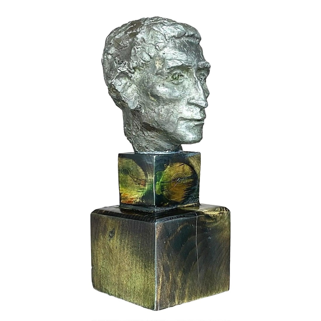 Aged Metal Sculpture Male Bust on Wooden Base: Aged Metal Sculpture Male Bust on Wooden Base This vintage patinated metal bust depicts a man with finely detailed features and a strong expression, highlighting classic sculptural techniques. The scu