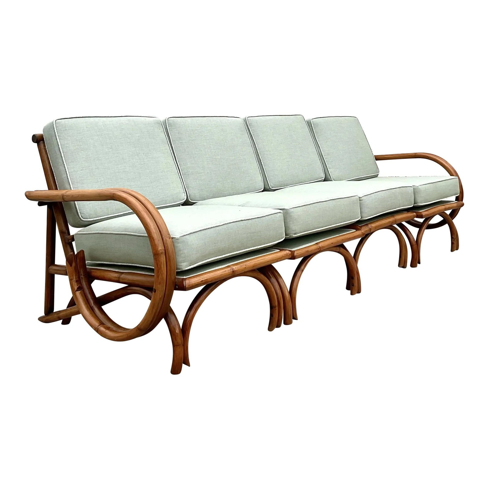 Vintage Coastal Bent Rattan Sofa Celadon Rattan Craftsmanship: Vintage Coastal Bent Rattan Sofa Celadon Rattan Craftsmanship Discover the effortless elegance of coastal living with this Vintage Coastal Bent Rattan Sofa. Featuring intricate, curved rattan construc