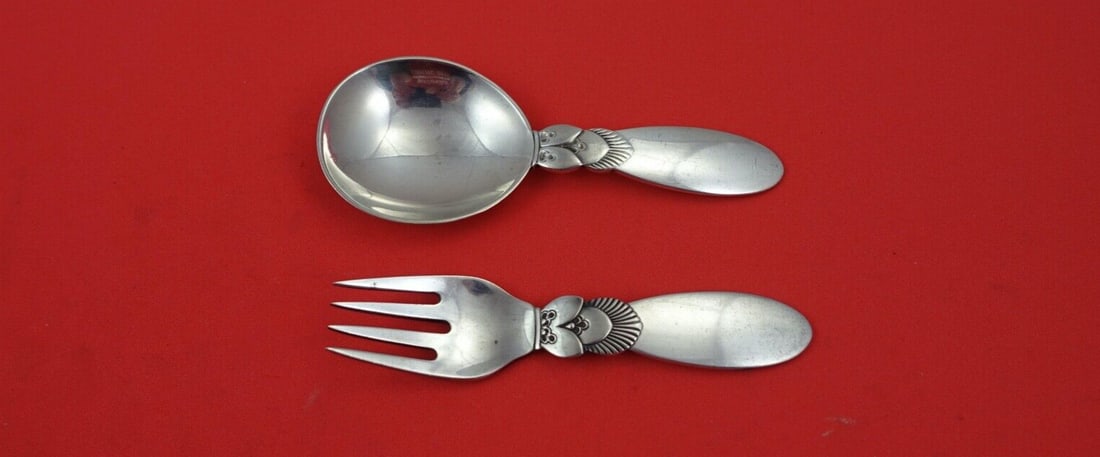 Georg Jensen Cactus Sterling Silver Baby Set 2-Piece 3 3/4": Georg Jensen Cactus Sterling Silver Baby Set 2-Piece 3 3/4" This exquisite 2-piece baby set from Georg Jensen features the iconic Cactus pattern, crafted from high-quality sterling silver. The set inc