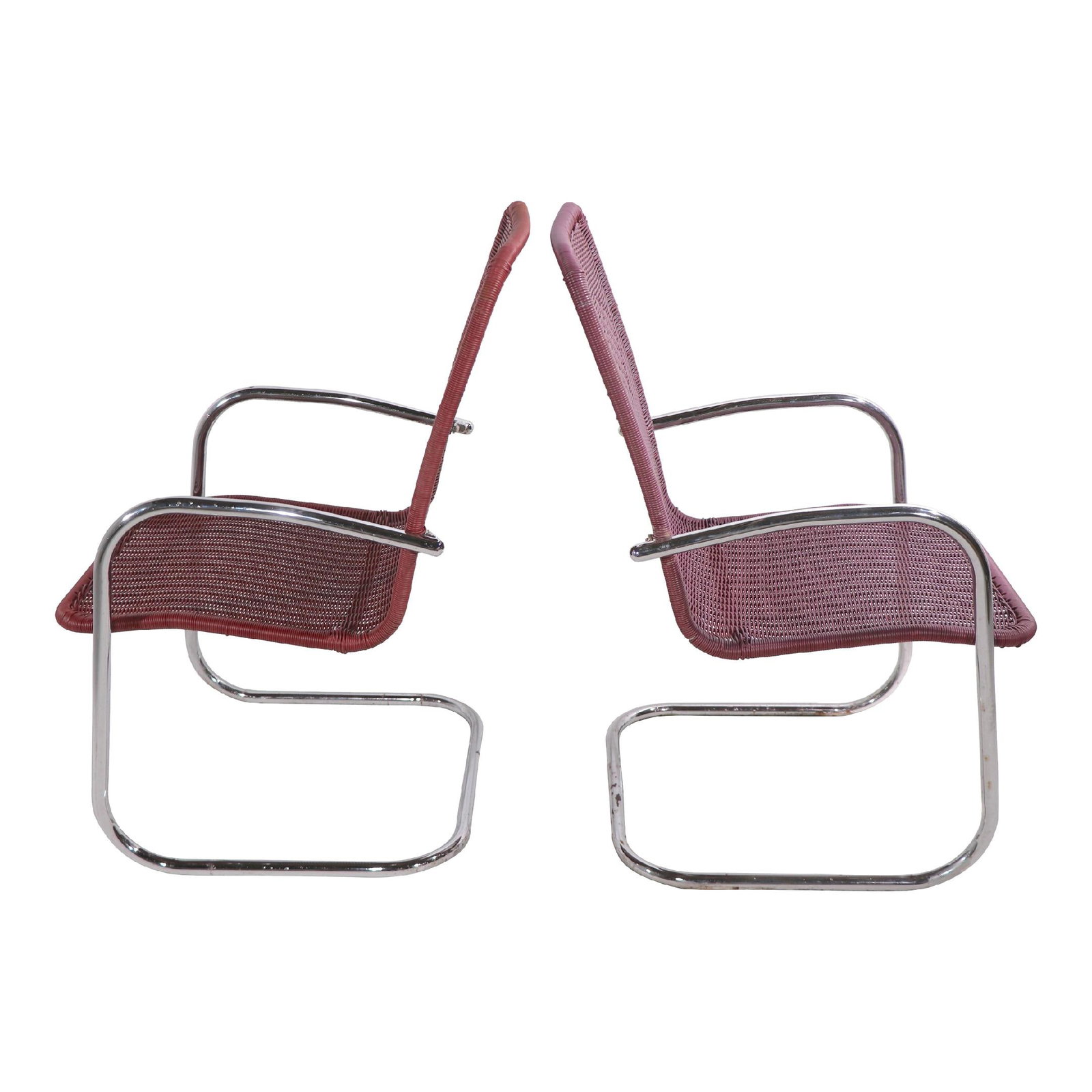 Chic Dark Pink Tubular Chrome Lounge Chairs by Lloyd Loom - Pair: Chic Dark Pink Tubular Chrome Lounge Chairs by Lloyd Loom - Pair This stylish pair of cantilevered lounge chairs features sleek tubular chrome frames complemented by continuous plastic wicker-style wo
