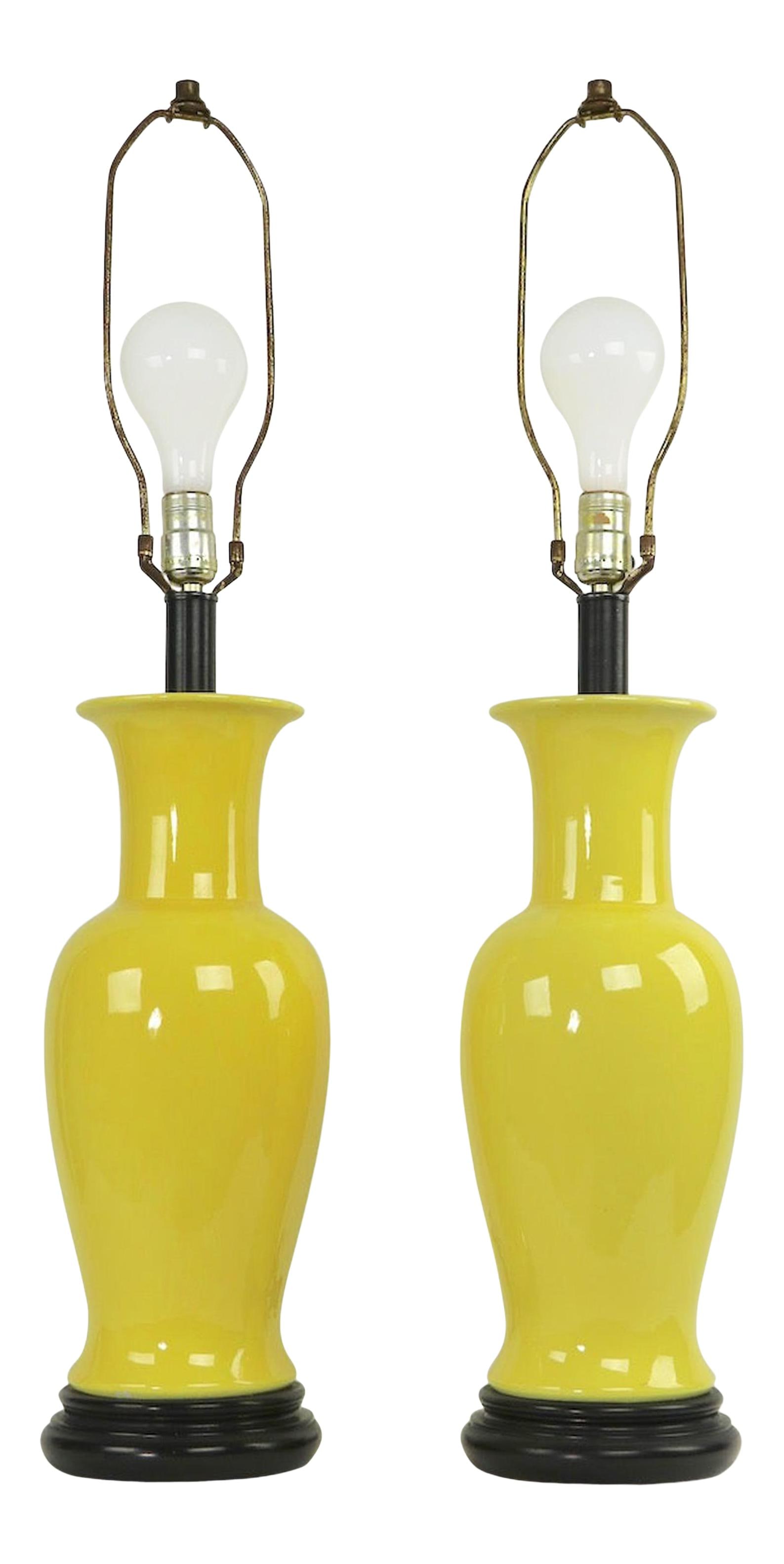 Pair of 1970s Yellow Ceramic Table Lamps by Warren Kessler: Pair of 1970s Yellow Ceramic Table Lamps by Warren Kessler This vibrant pair of ceramic table lamps features a bright yellow glaze and is attributed to the talented artist Warren Kessler. Hailing from