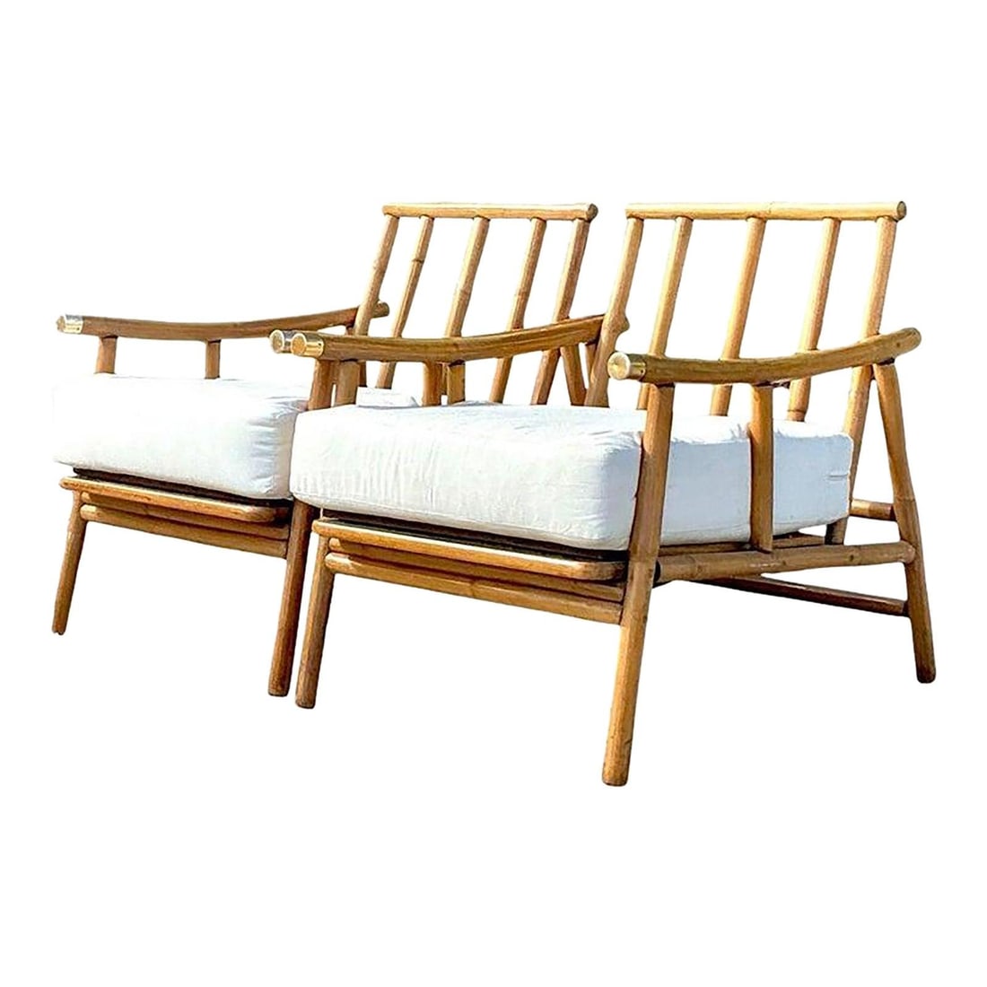 Vintage Ficks Reed Rattan Lounge Chairs Pair Coastal Charm: Vintage Ficks Reed Rattan Lounge Chairs Pair Coastal Charm Transform your space into a tranquil coastal haven with this pair of vintage bent rattan lounge chairs. These chairs showcase elegantly curve
