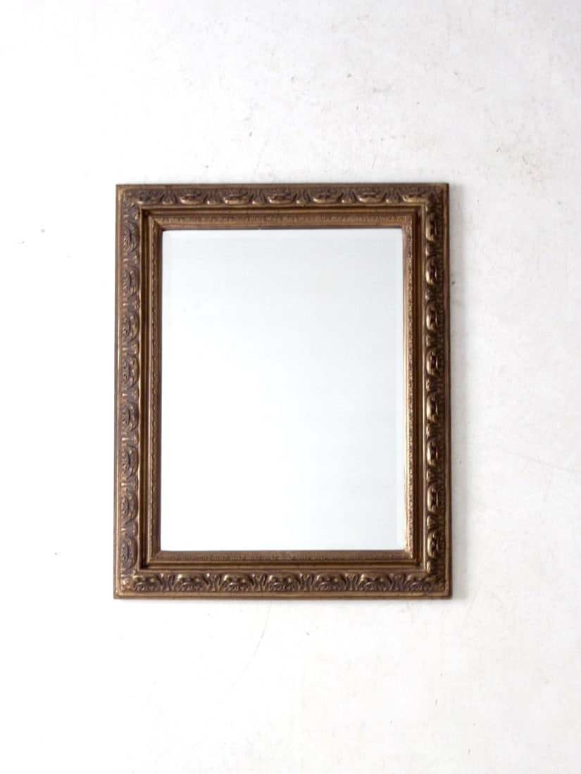 Elegant Vintage Gilt Wood Beveled Wall Mirror 30.75 x 24.5: Elegant Vintage Gilt Wood Beveled Wall Mirror 30.75 x 24.5 This vintage gilt wood beveled wall mirror showcases a classic design complemented by elegant craftsmanship. The ornate gilt wood frame featu