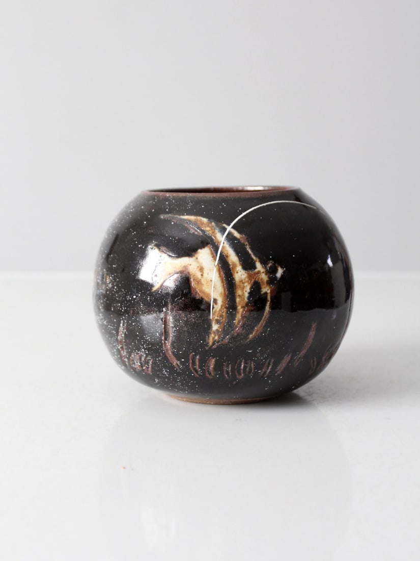 Handmade Vintage Studio Pottery Vase with Celestial Design 5" Height: Handmade Vintage Studio Pottery Vase with Celestial Design 5" Height This vintage studio pottery vase showcases exquisite craftsmanship with its handmade bowl design, featuring a striking near-black g
