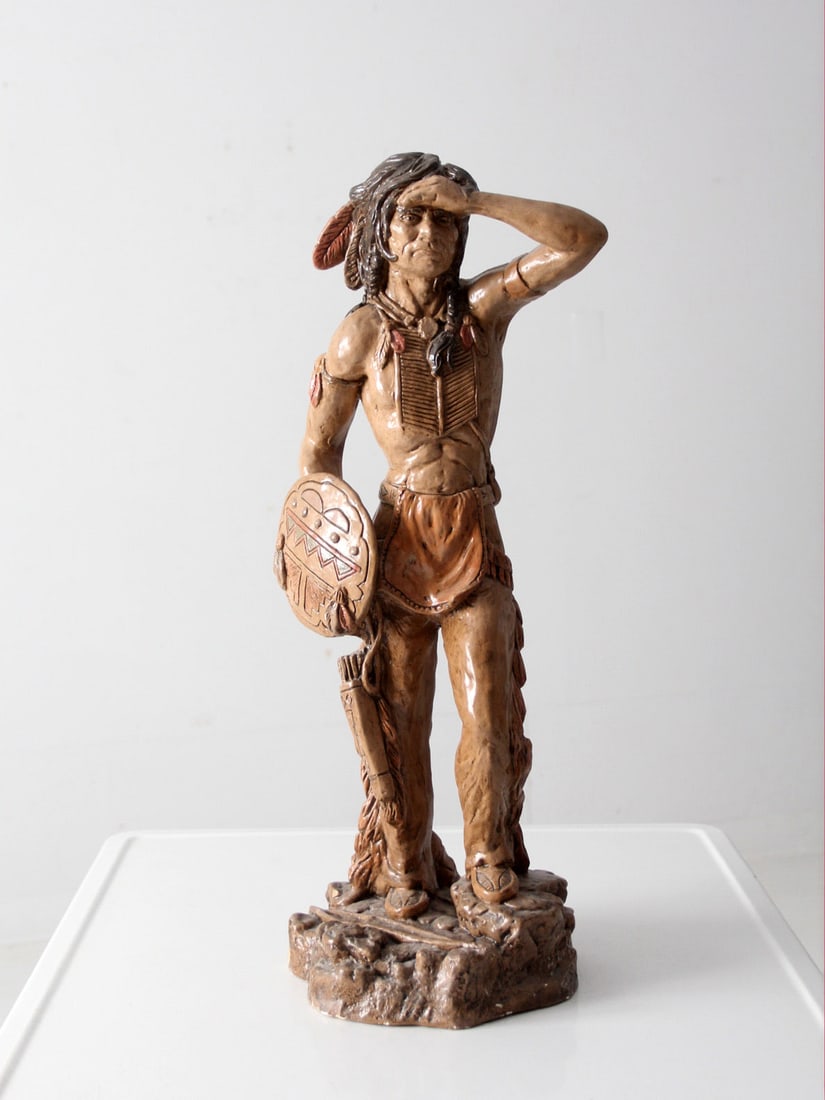 1970s Vintage Native American Statuette by Vaungh Kendrick: 1970s Vintage Native American Statuette by Vaungh Kendrick This vintage Native American Indian statuette, dating back to the 1970s, showcases remarkable texture and detail, attributed to Vaungh Kendri