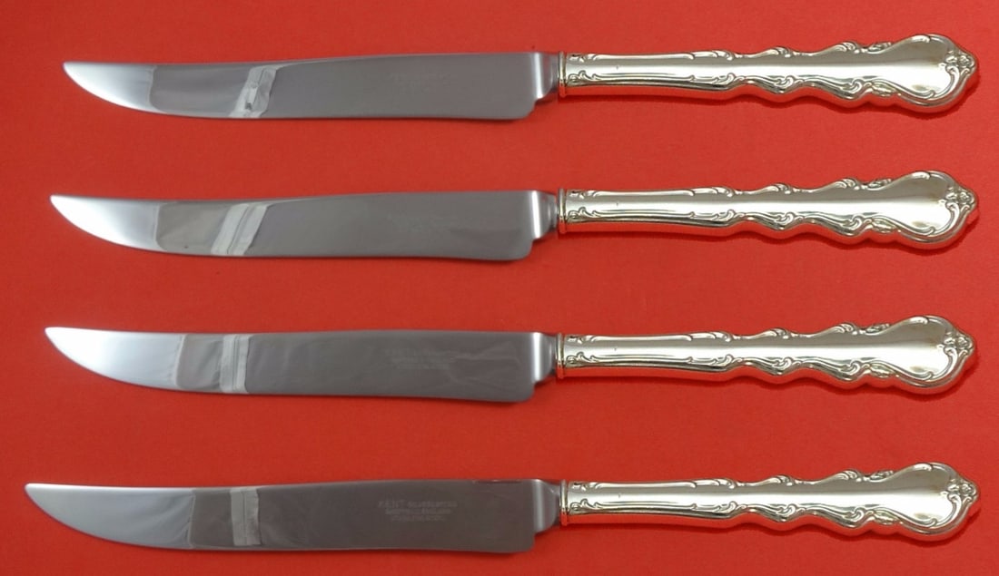 International Angelique Sterling Silver Texas Sized Steak Knife Set 4-Piece: International Angelique Sterling Silver Texas Sized Steak Knife Set 4-Piece Introducing the Angelique by International Sterling Silver Steak Knife Set, a luxurious addition to your dining experience. 