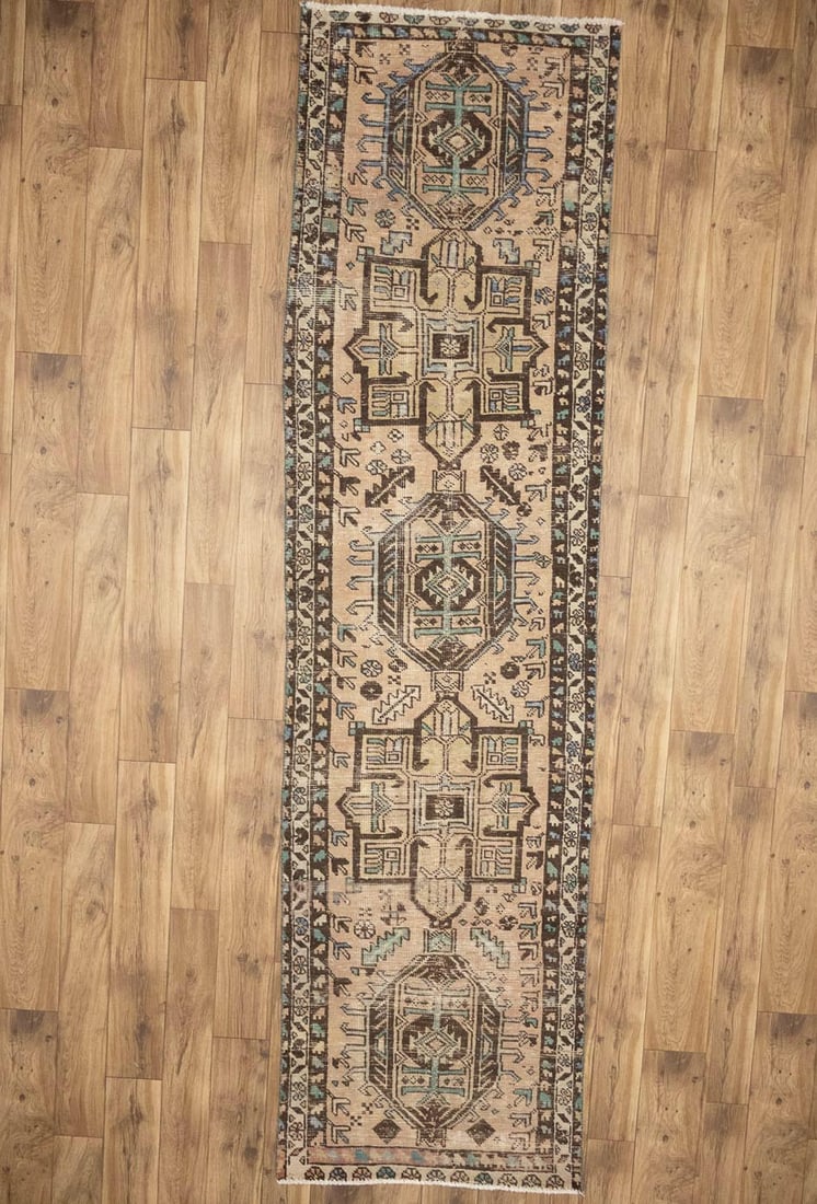 Vintage Hand-Knotted Wool Runner Rug in Muted Tones 2'9 x 10'5: Vintage Hand-Knotted Wool Runner Rug in Muted Tones 2'9 x 10'5 This handmade semi-antique oriental runner rug features a muted color palette with light salmon, brown, green, and other tones. Crafted i