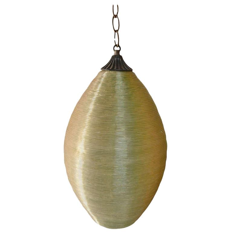 Retro Spun Plastic Football Hanging Light Fixture: Retro Spun Plastic Football Hanging Light Fixture This vintage Spun Plastic Football Shape Hanging Fixture features a textured spun fiberglass surface that appears crystal in color. When illuminated, 