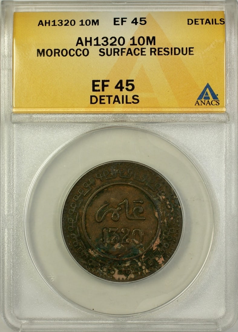Morocco 1902 Bronze 10 Mazunas ANACS EF 45 Graded Coin With Surface Residue: Morocco 1902 Bronze 10 Mazunas ANACS EF 45 Graded Coin With Surface Residue This 10 Mazunas coin from Morocco dates to AH1320 (1902) and is certified by ANACS with an EF 45 grade, indicating it is in 