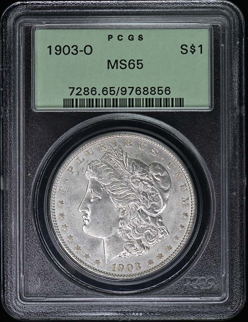 1903-O Morgan Dollar PCGS MS65 Uncirculated New Orleans: 1903-O Morgan Dollar PCGS MS65 Uncirculated New Orleans This 1903-O Morgan Dollar is a remarkable piece certified by PCGS with a grade of MS65, indicating its uncirculated condition. Minted in New Orl