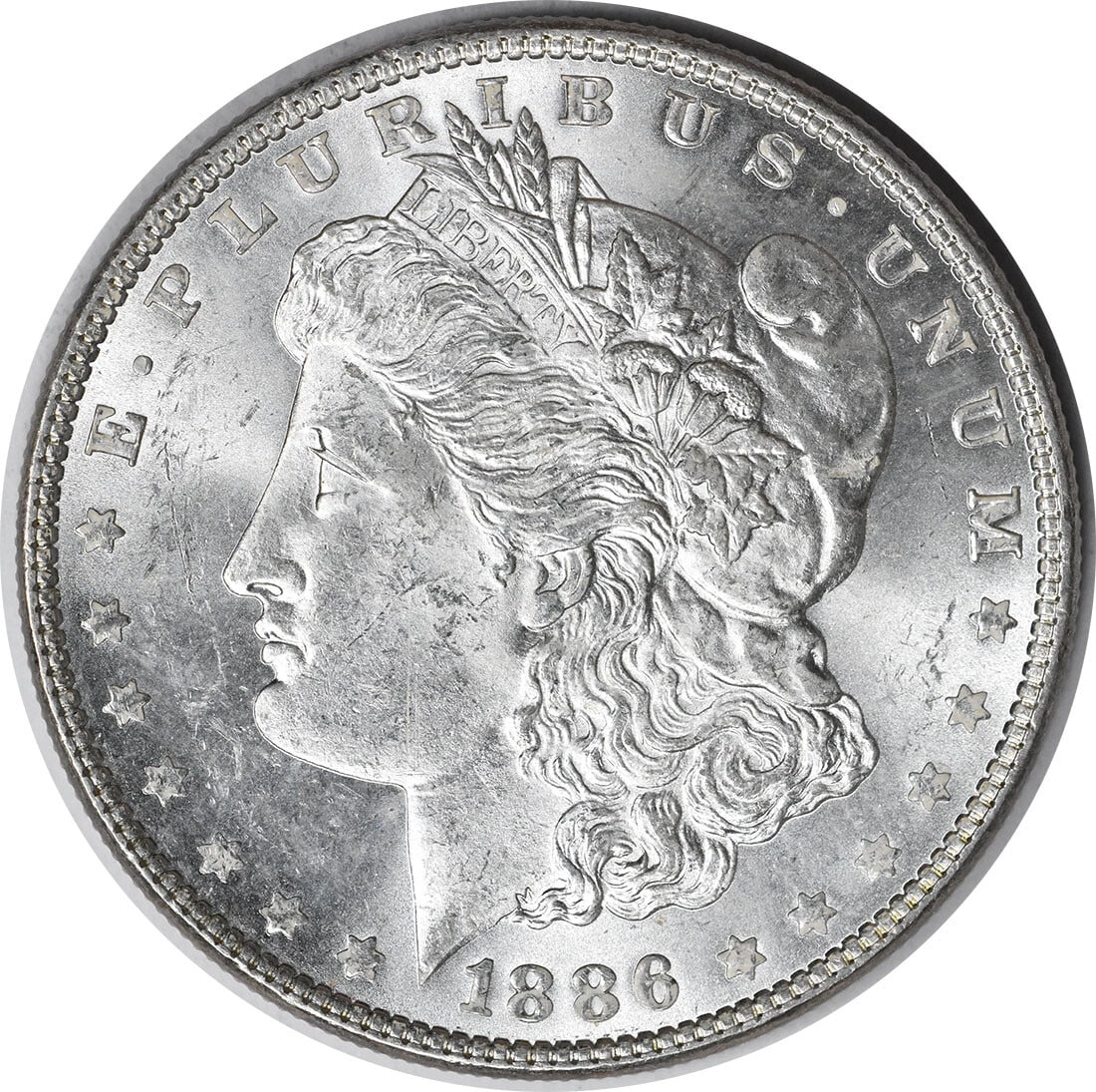 Choice BU 1886 Silver Dollar Morgan Toned Uncertified Philadelphia Issue: Choice BU 1886 Silver Dollar Morgan Toned Uncertified Philadelphia Issue This is an 1886 Morgan Silver Dollar from the United States, featuring a beautiful toned appearance. The coin is uncertified an