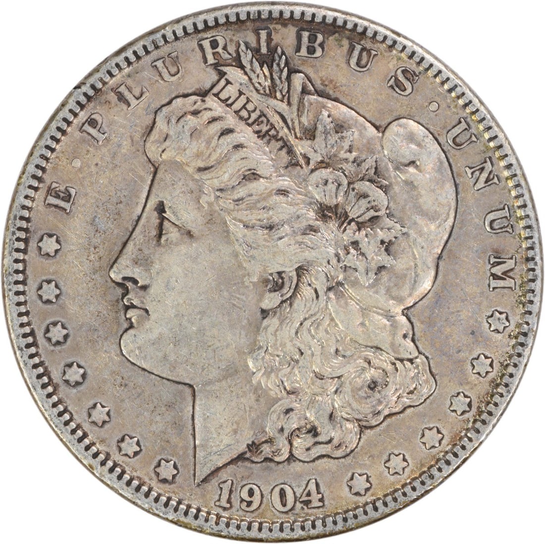 1904 Philadelphia Morgan Dollar 90 Percent Silver Extra Fine Uncertified: 1904 Philadelphia Morgan Dollar 90 Percent Silver Extra Fine Uncertified This 1904 Morgan Silver Dollar was struck in Philadelphia and is composed of 90% silver and 10% copper. Designed by George T. M