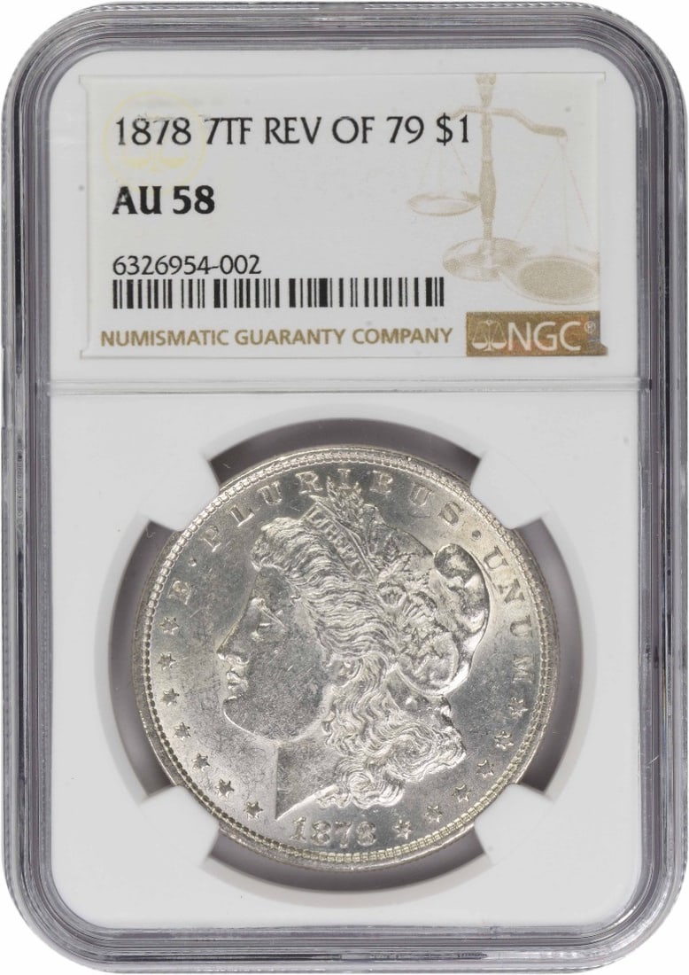 NGC AU58 1878 Morgan Dollar 7 Tail Feathers Reverse of 1879 Silver Coin: NGC AU58 1878 Morgan Dollar 7 Tail Feathers Reverse of 1879 Silver Coin This is an 1878 Morgan Silver Dollar featuring the 7 Tail Feathers Reverse of 1879 variety. Graded AU58 by NGC, this coin was mi