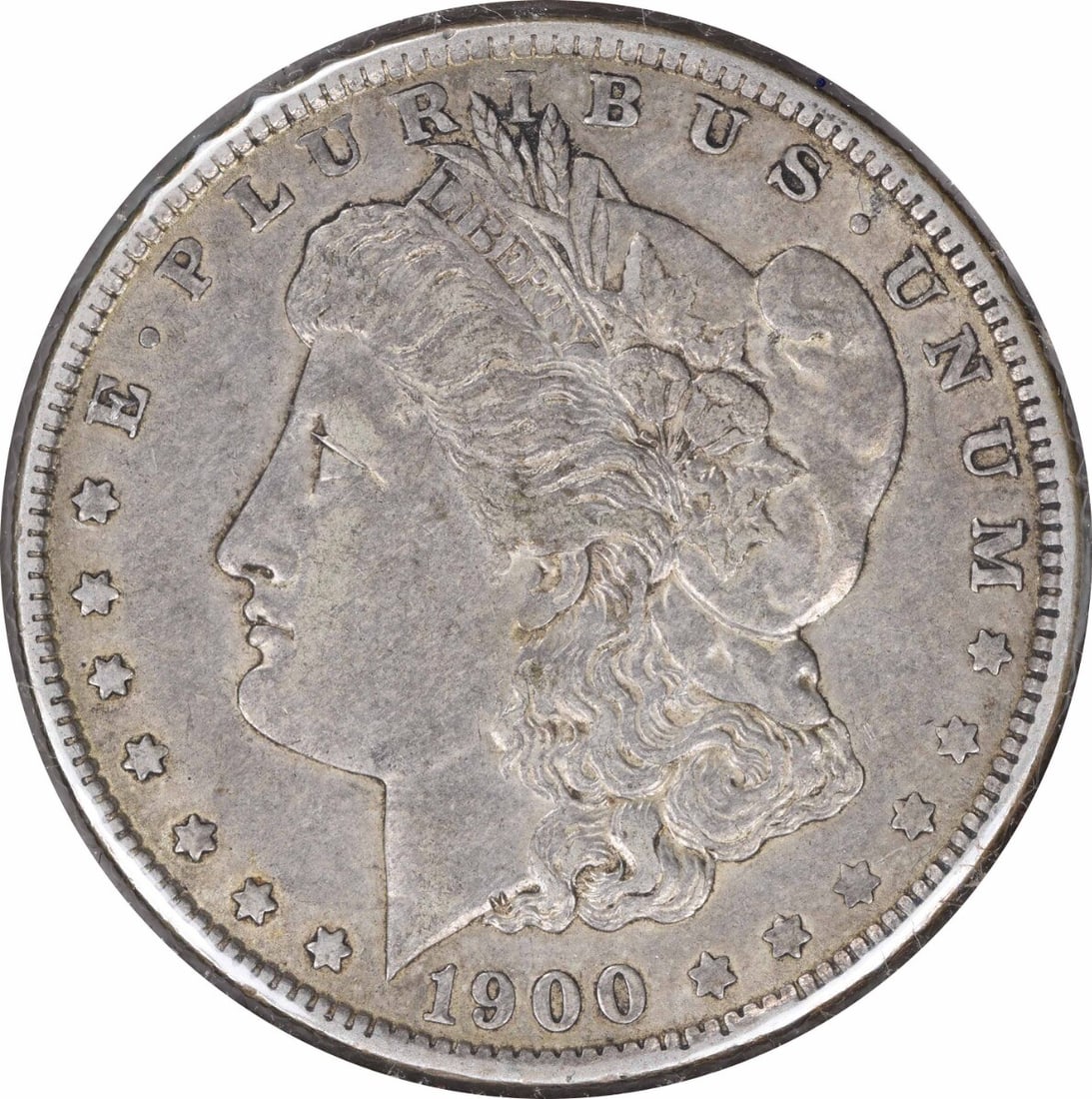 1900-O Morgan Silver Dollar Choice EF Uncertified 90% Silver Coin: 1900-O Morgan Silver Dollar Choice EF Uncertified 90% Silver Coin This 1900-O/CC Morgan Silver Dollar is a remarkable piece, showcasing intricate design by George T. Morgan. With a composition of 90% 