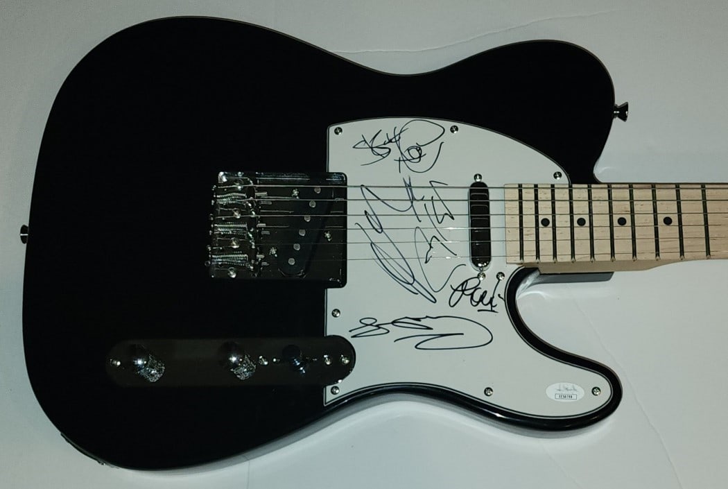 Spandau Ballet Signed Electric Guitar JSA Authenticated Tony Hadley Gary Kemp Steve Norman: Spandau Ballet Signed Electric Guitar JSA Authenticated Tony Hadley Gary Kemp Steve Norman This authentic electric guitar is signed by the renowned Spandau Ballet band members, including Tony Hadley, 
