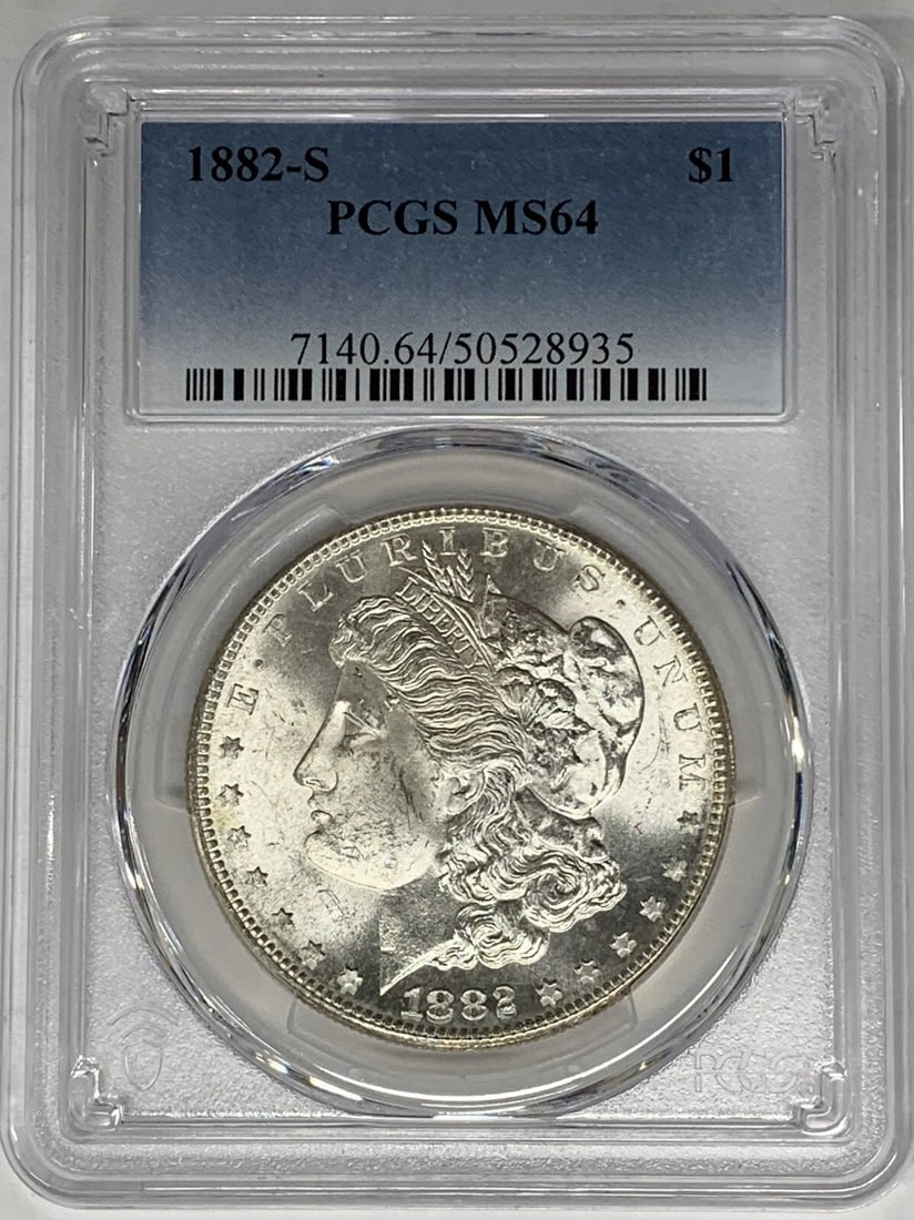 1882-S Morgan Silver Dollar Uncirculated PCGS MS 64 Silver Coin: 1882-S Morgan Silver Dollar Uncirculated PCGS MS 64 Silver Coin This 1882-S Morgan Silver Dollar is a remarkable piece of American history, representing the iconic design by George T. Morgan. Graded M