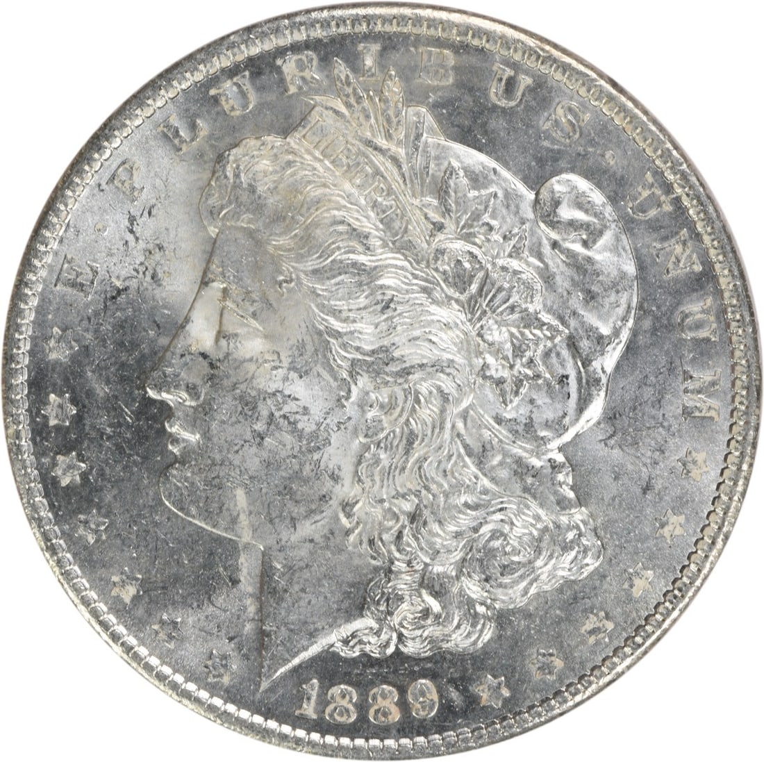 Brilliant Uncirculated 1889 Morgan Silver Dollar Uncertified No Mint Mark: Brilliant Uncirculated 1889 Morgan Silver Dollar Uncertified No Mint Mark This is an 1889 Morgan Silver Dollar from the United States, featuring a Brilliant Uncirculated (BU) grade. The coin is compos