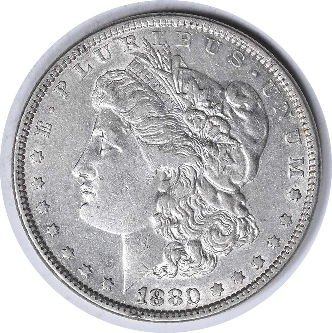 1880 VAM 39A Morgan Silver Dollar AU Uncertified 90% Silver Coin: 1880 VAM 39A Morgan Silver Dollar AU Uncertified 90% Silver Coin This 1880 VAM 39A Morgan Silver Dollar is a classic collectible coin, featuring a striking design by George T. Morgan. The coin is comp