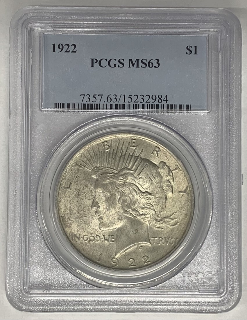 PCGS MS 63 1922 Peace Dollar Silver Coin With Toning: PCGS MS 63 1922 Peace Dollar Silver Coin With Toning This is a 1922 Peace Silver Dollar coin from the United States, composed of silver and featuring a toned finish. The coin is uncirculated and has b