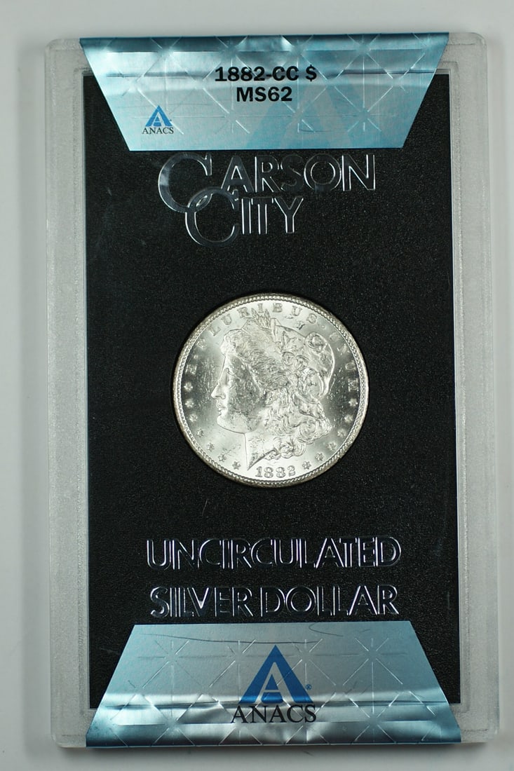 1882 Carson City Morgan Dollar ANACS MS62 in GSA Holder with Box and COA: 1882 Carson City Morgan Dollar ANACS MS62 in GSA Holder with Box and COA This 1882-CC Morgan Silver Dollar coin is certified by ANACS with a grade of MS 62. Struck at the Carson City Mint, it is compo