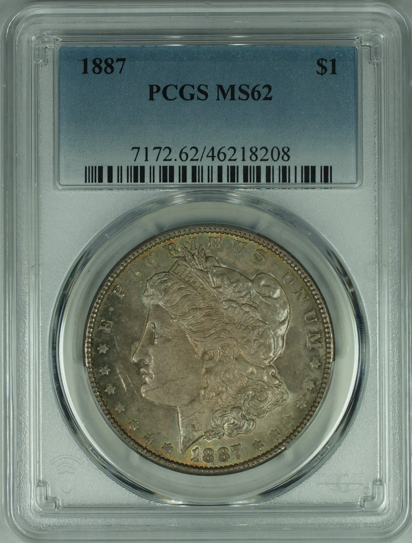 PCGS MS-62 1887 Morgan Dollar with Attractive Toning: PCGS MS-62 1887 Morgan Dollar with Attractive Toning This 1887 Morgan Silver Dollar is certified by PCGS with a grade of MS-62 and features attractive toning. Minted in Philadelphia, it is composed of